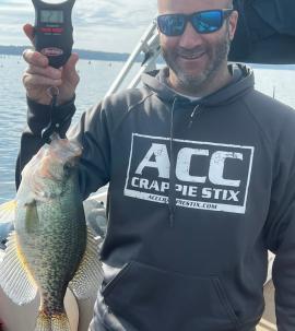Image of fishing guide holding a fresh caught crappie fish