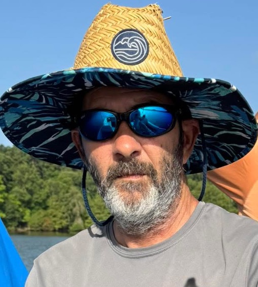 Image of fishing guide holding a fresh caught bass
